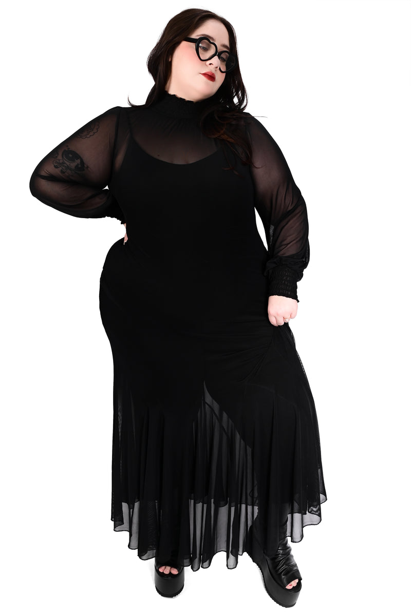 Flowing mesh dress with open flared godet skirt, a smocked neck and long sleeves