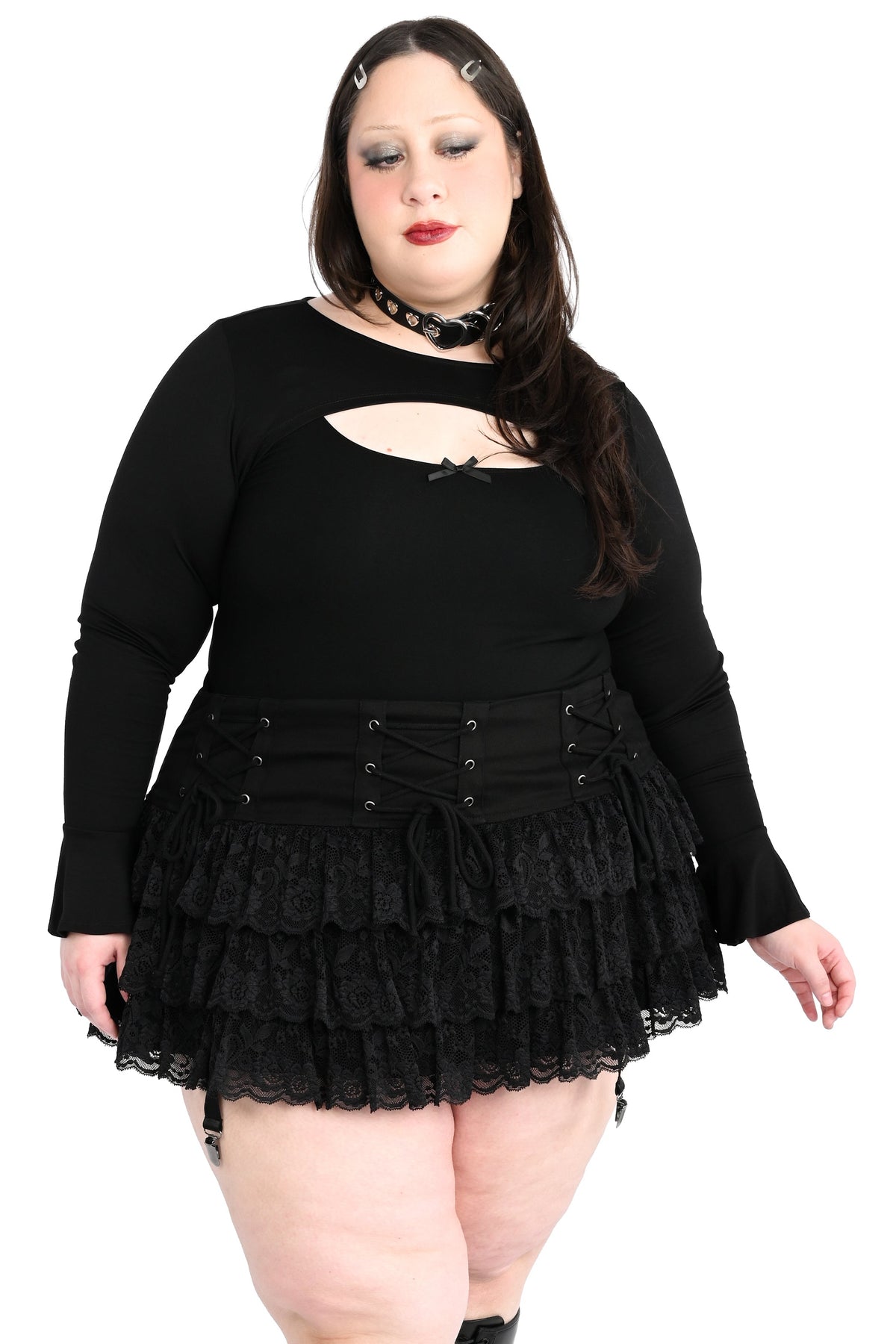 Mini skirt with adjustable lacing on the hip and ruffly lace.