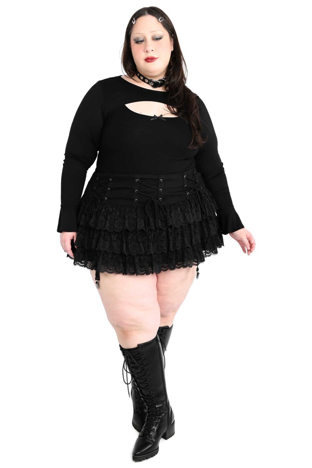 Mini skirt with adjustable lacing on the hip and ruffly lace.