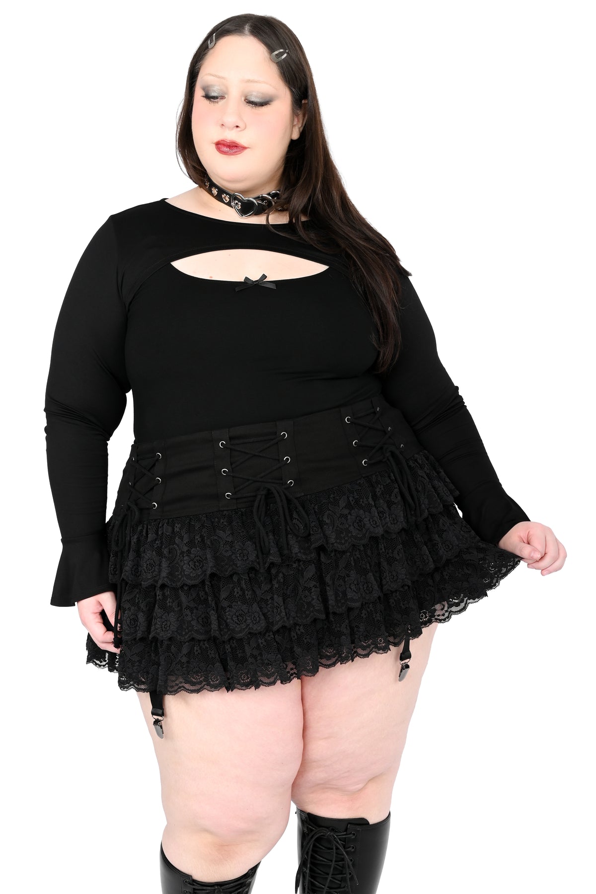 Mini skirt with adjustable lacing on the hip and ruffly lace.