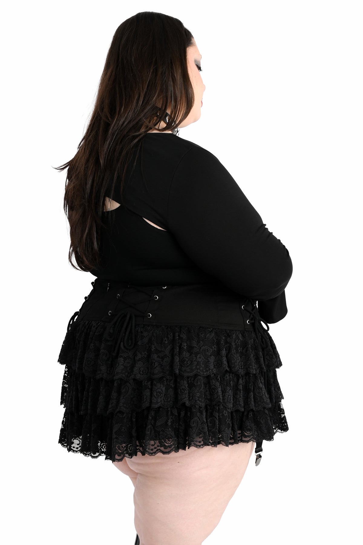 Mini skirt with adjustable lacing on the hip and ruffly lace.