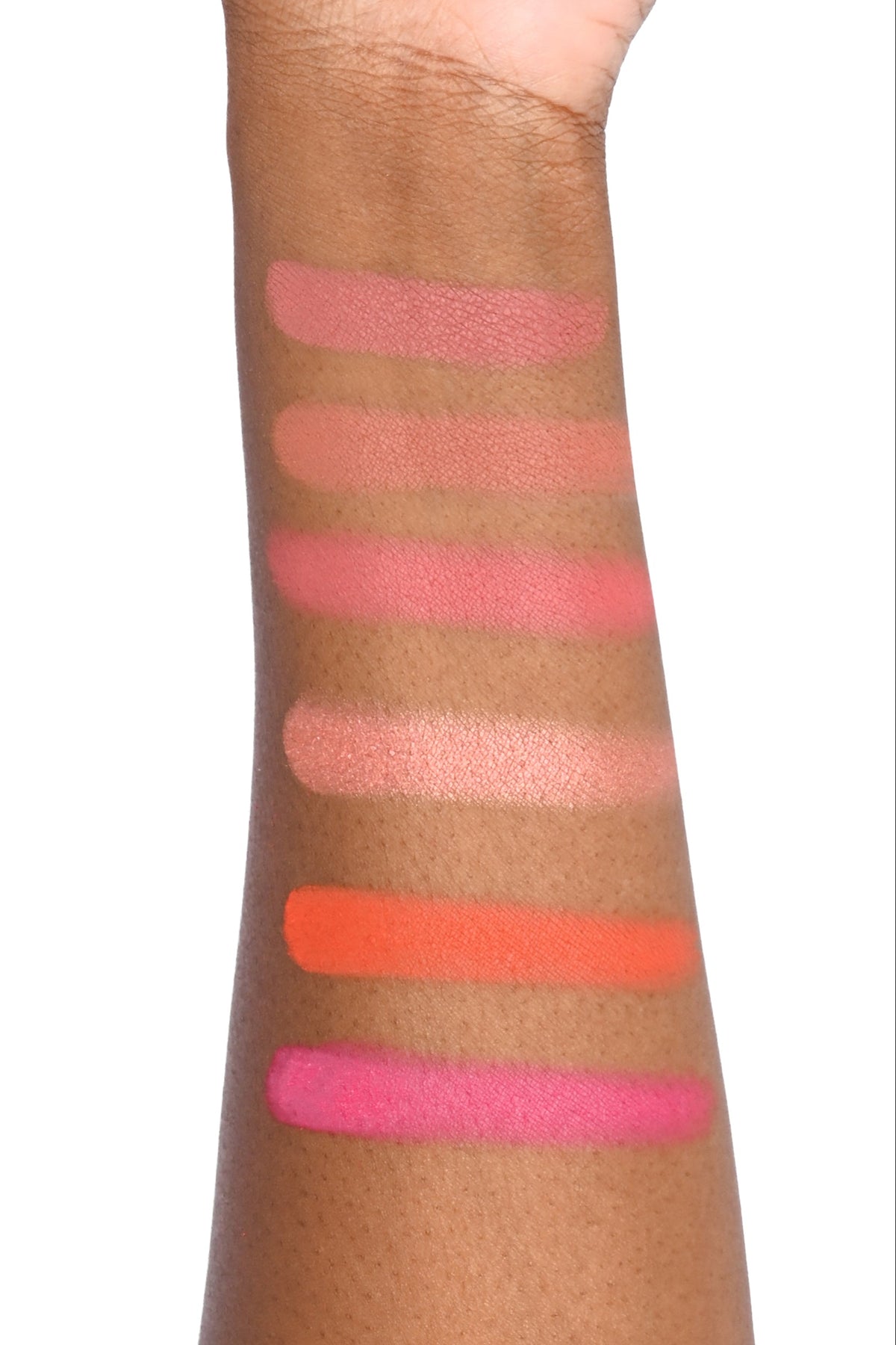 our darling blush swatched on a medium brown skin arm - Order - Camellia, Honeysuckle, Rose, Dahlia, Zinnia, Azalea