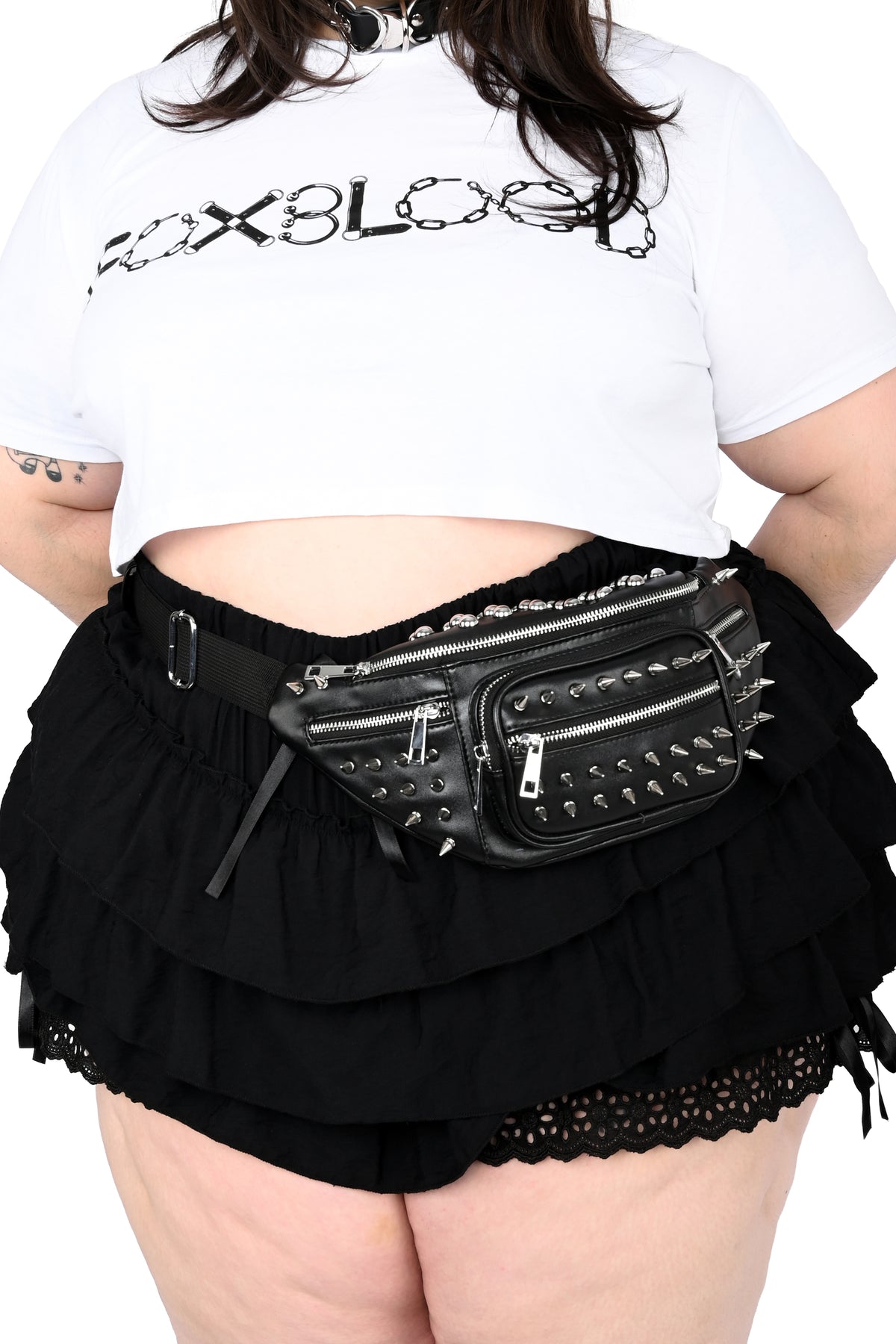 Black PU fanny pack covered in silver studs.
