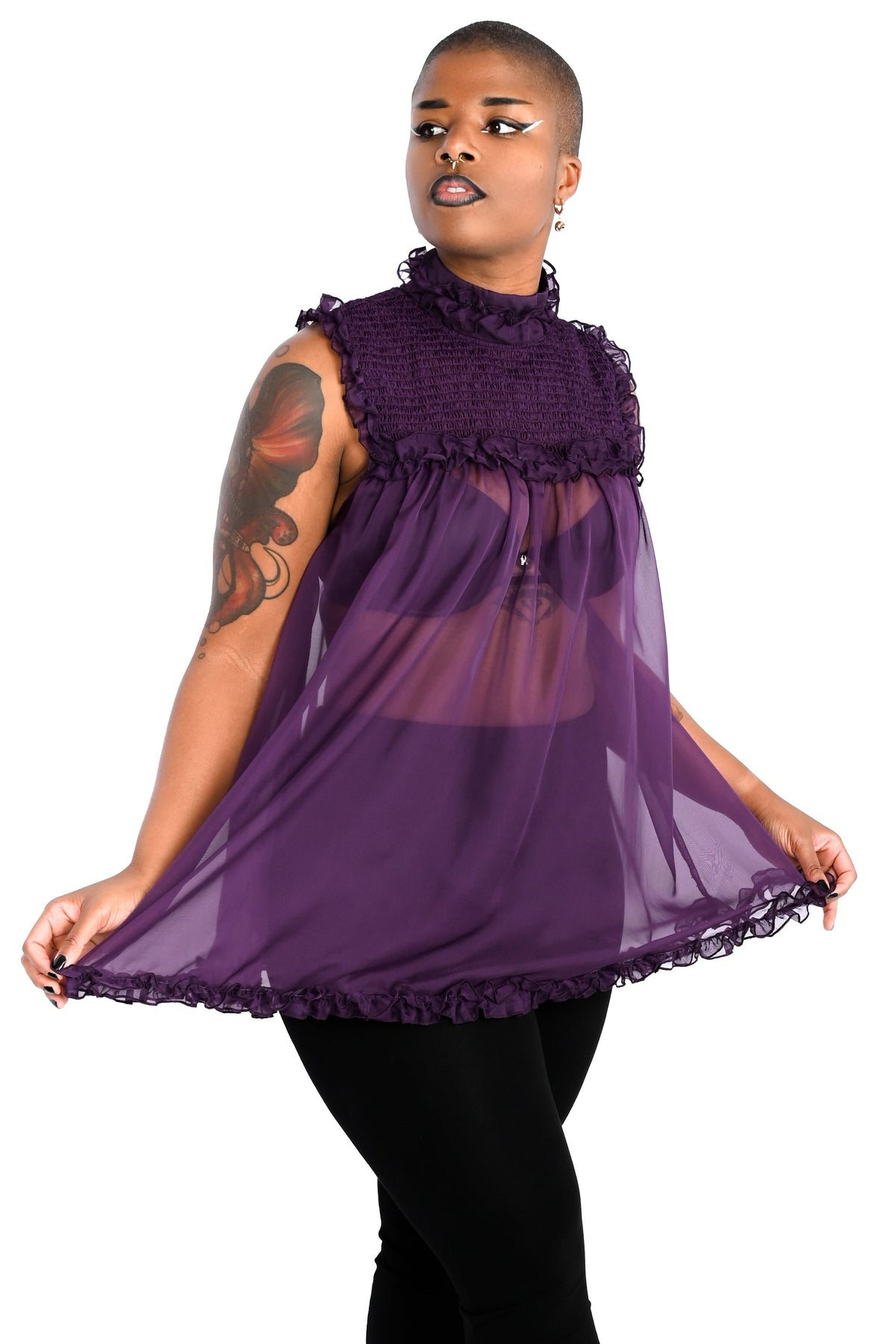 deep purple chiffon babydoll dress with smocking on the neckline and ruffle bottom hem