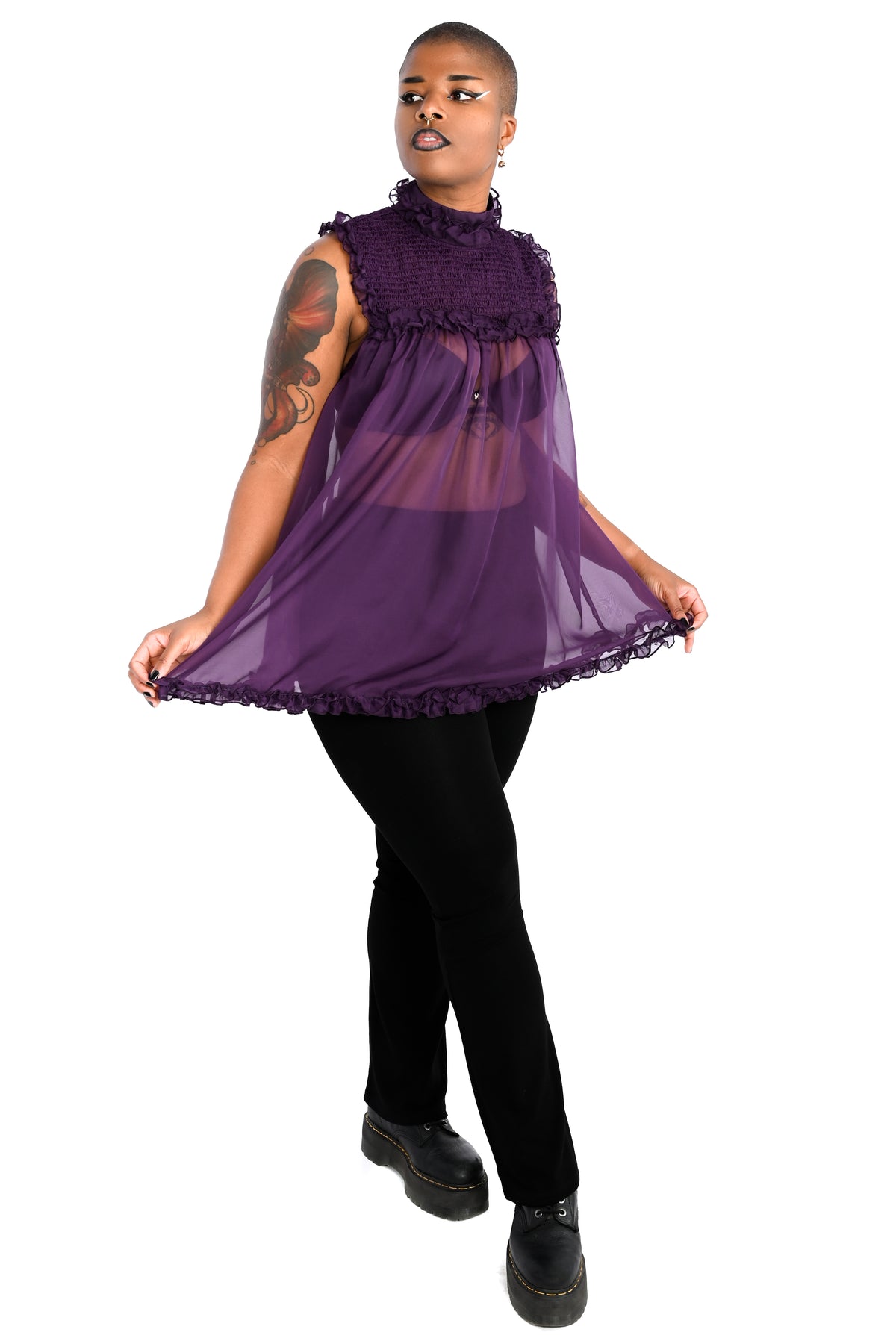 deep purple chiffon babydoll dress with smocking on the neckline and ruffle bottom hem