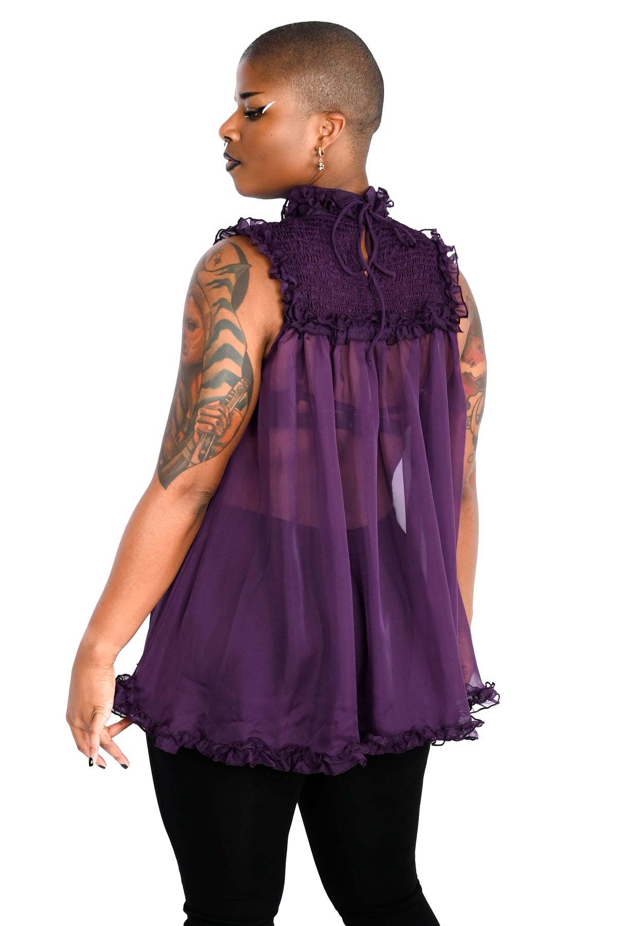 deep purple chiffon babydoll dress with smocking on the neckline and ruffle bottom hem