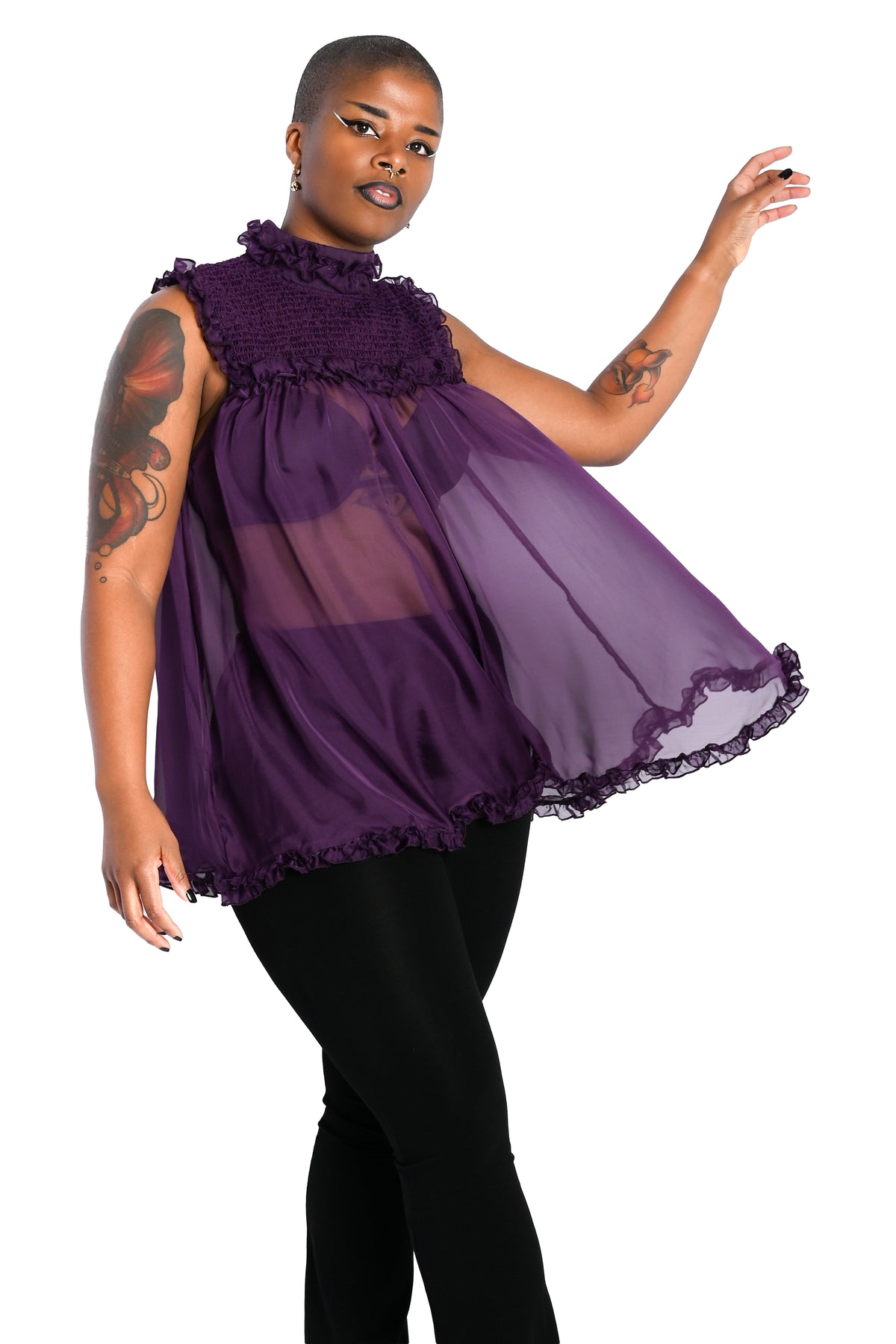deep purple chiffon babydoll dress with smocking on the neckline and ruffle bottom hem