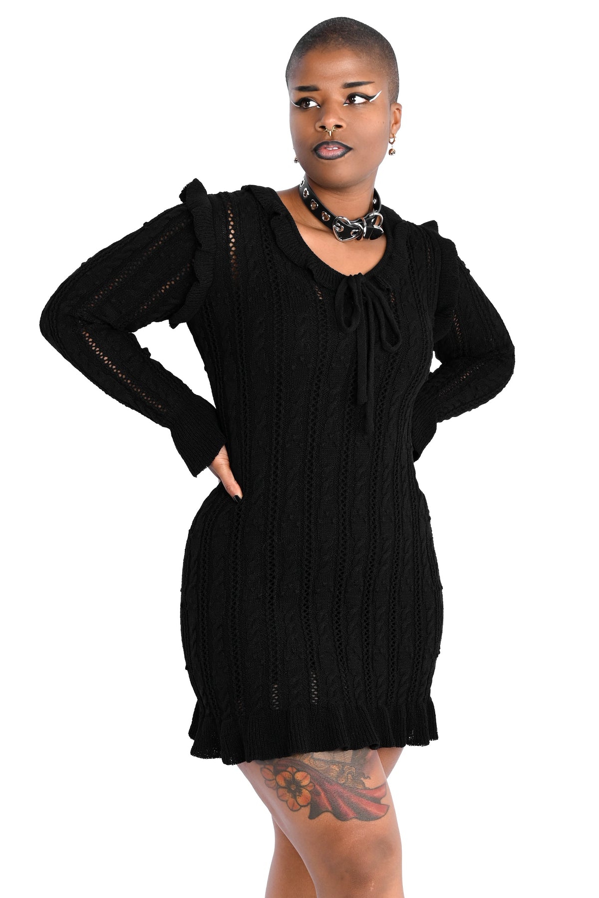 Black sweater dress with cute ruffly shoulders, bottom hem and tie neckline.