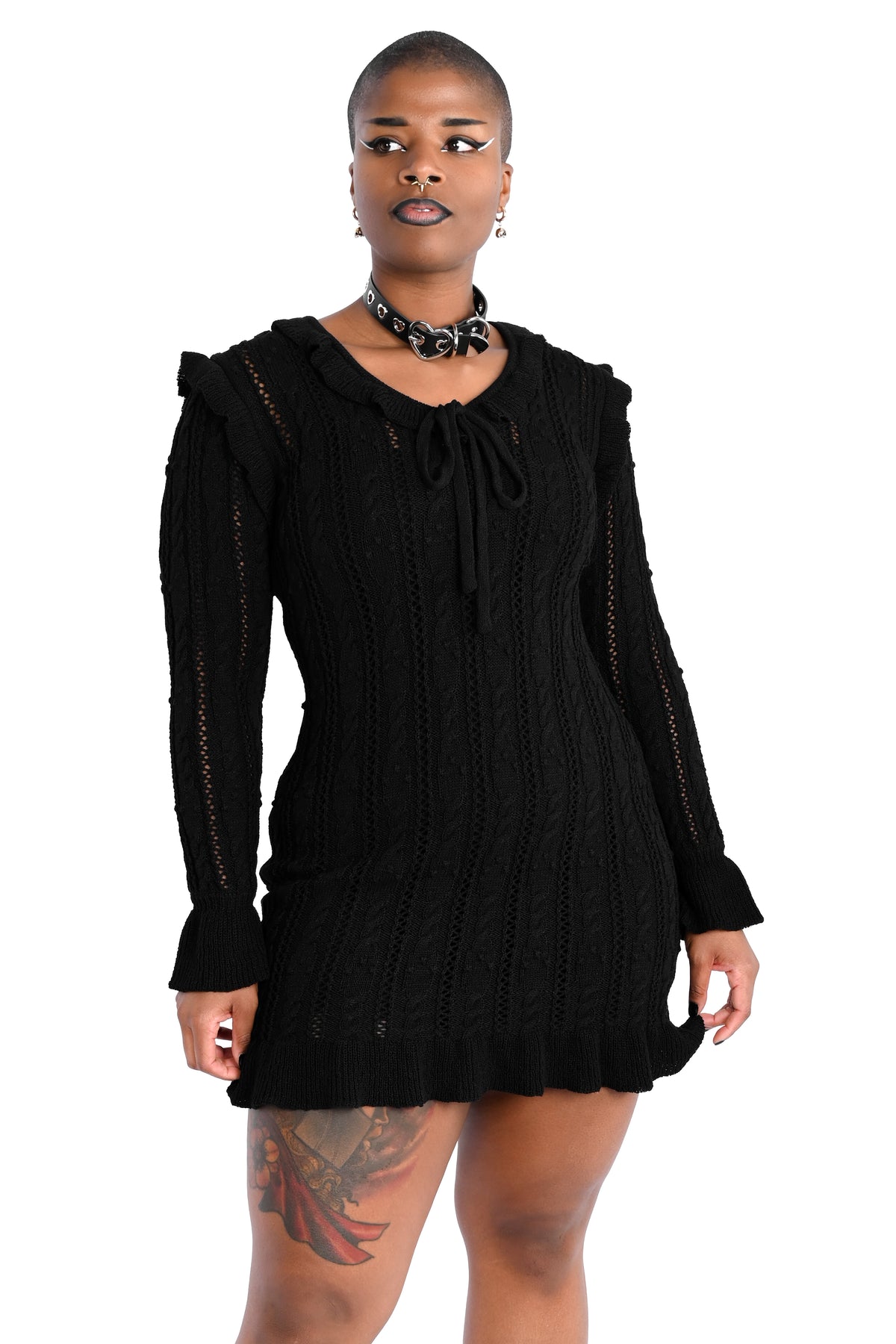 Black sweater dress with cute ruffly shoulders, bottom hem and tie neckline.