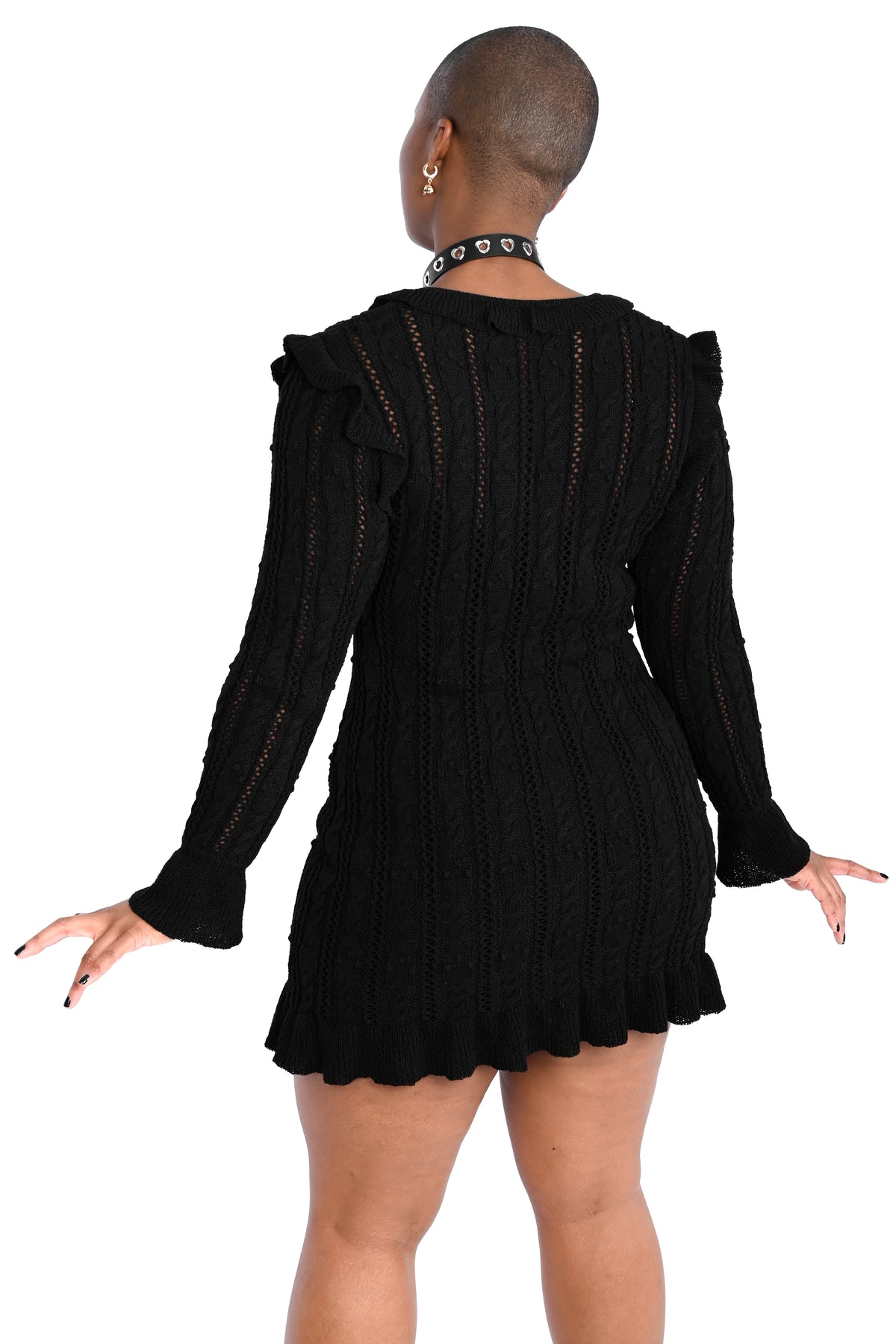 Black sweater dress with cute ruffly shoulders, bottom hem and tie neckline.