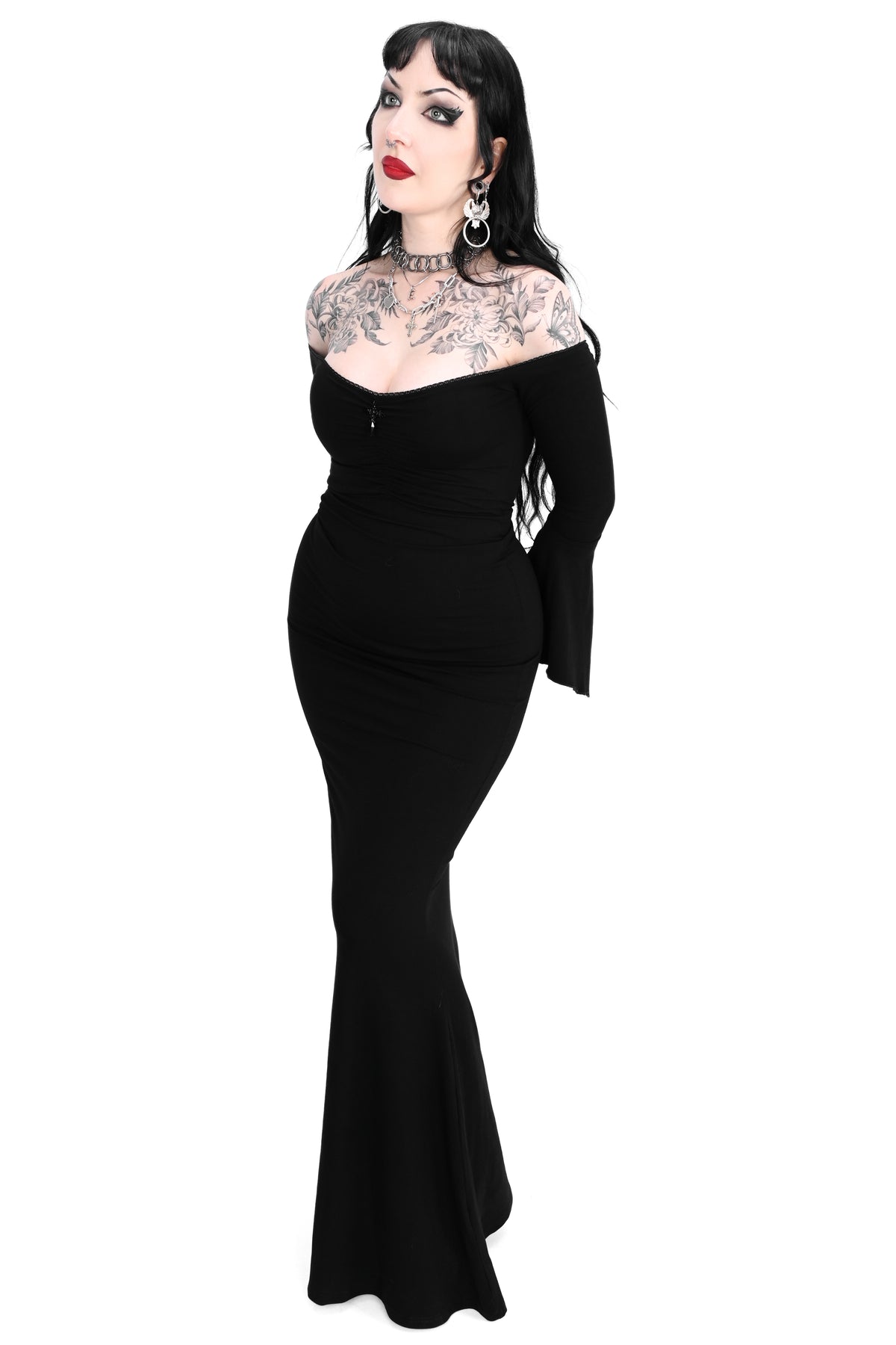 black bell sleeve off the shoulder maxi dress with flared bottom and dagger pendant in the middle of the neckline