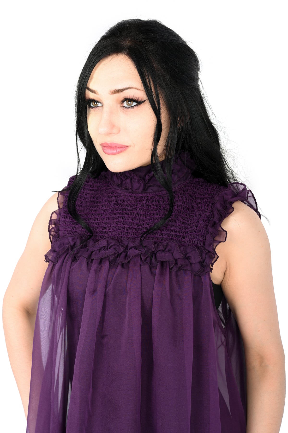 deep purple chiffon babydoll dress with smocking on the neckline and ruffle bottom hem