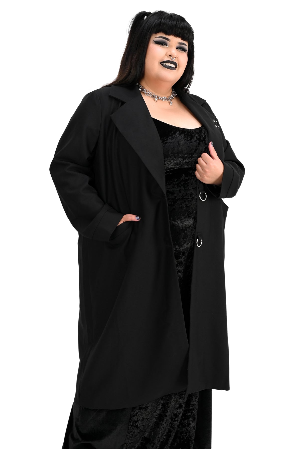 Long black trench coat with two o-ring piercing details on the left lapel