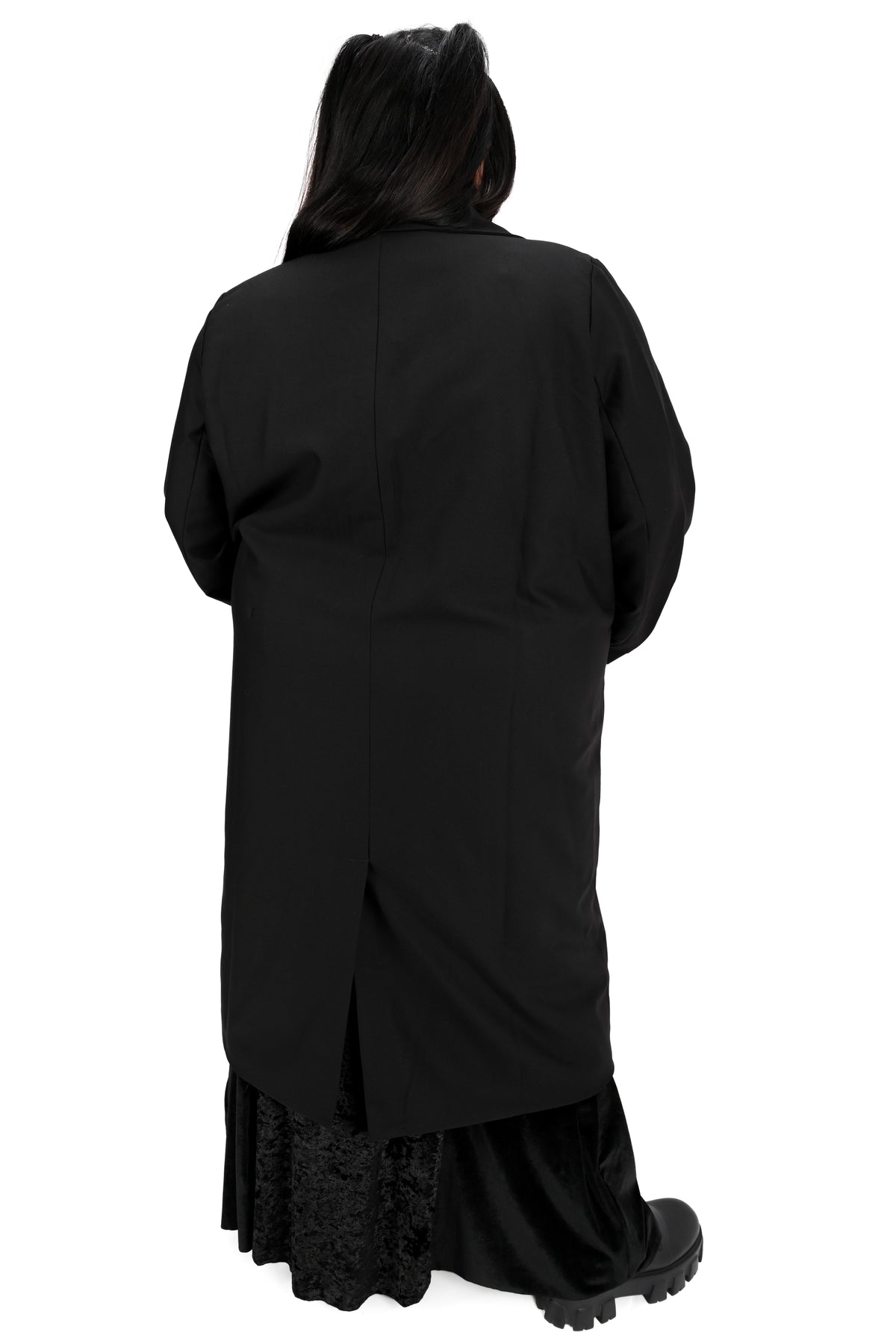 Long black trench coat with two o-ring piercing details on the left lapel