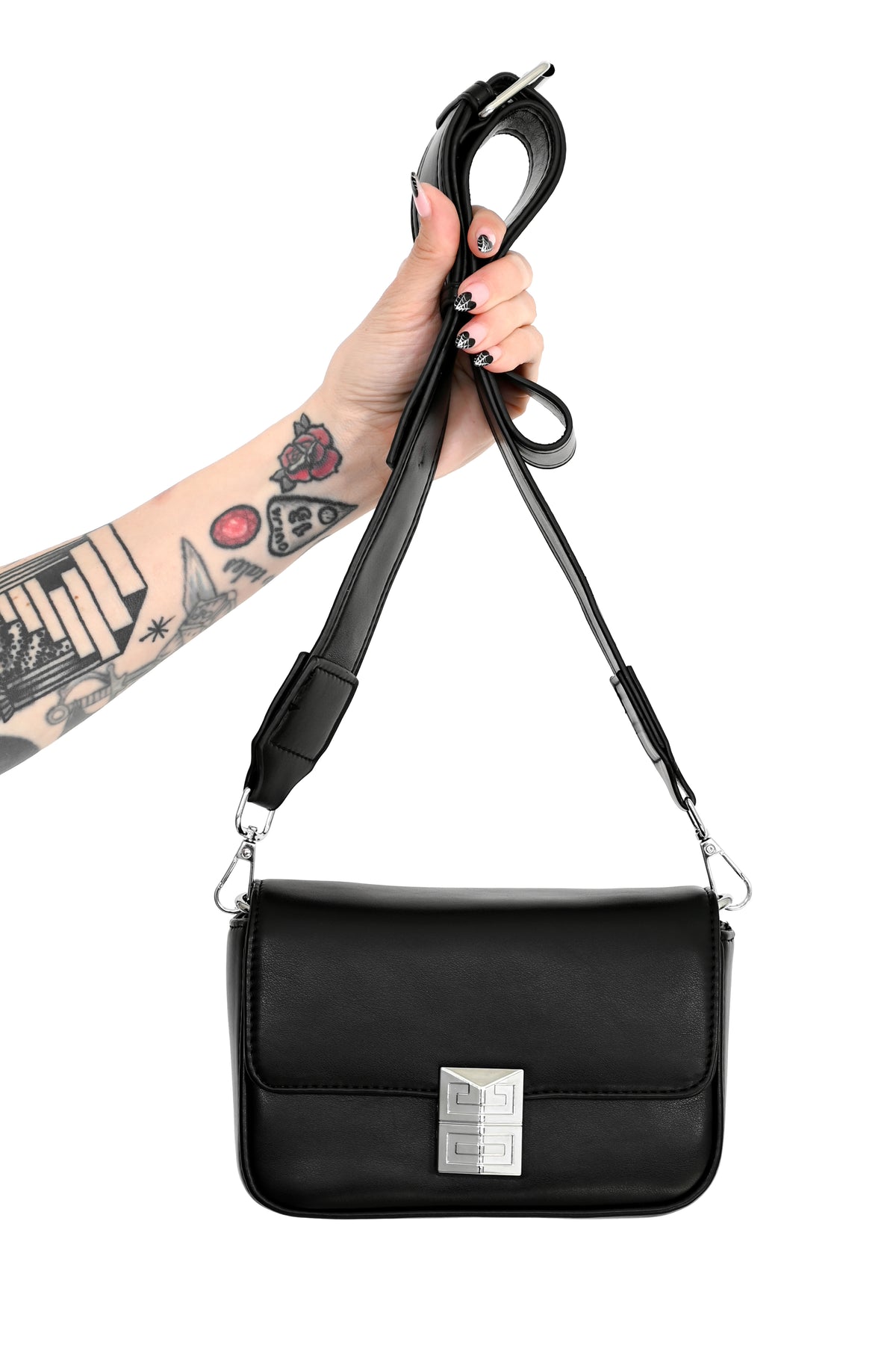 black faux leather bag with front detailed magnetic closure and faux leather crossbody strap