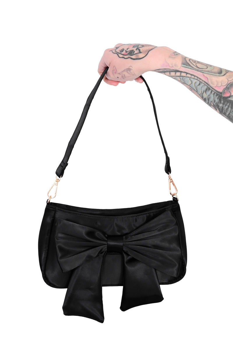 black satin shoulder bag with large bow on front