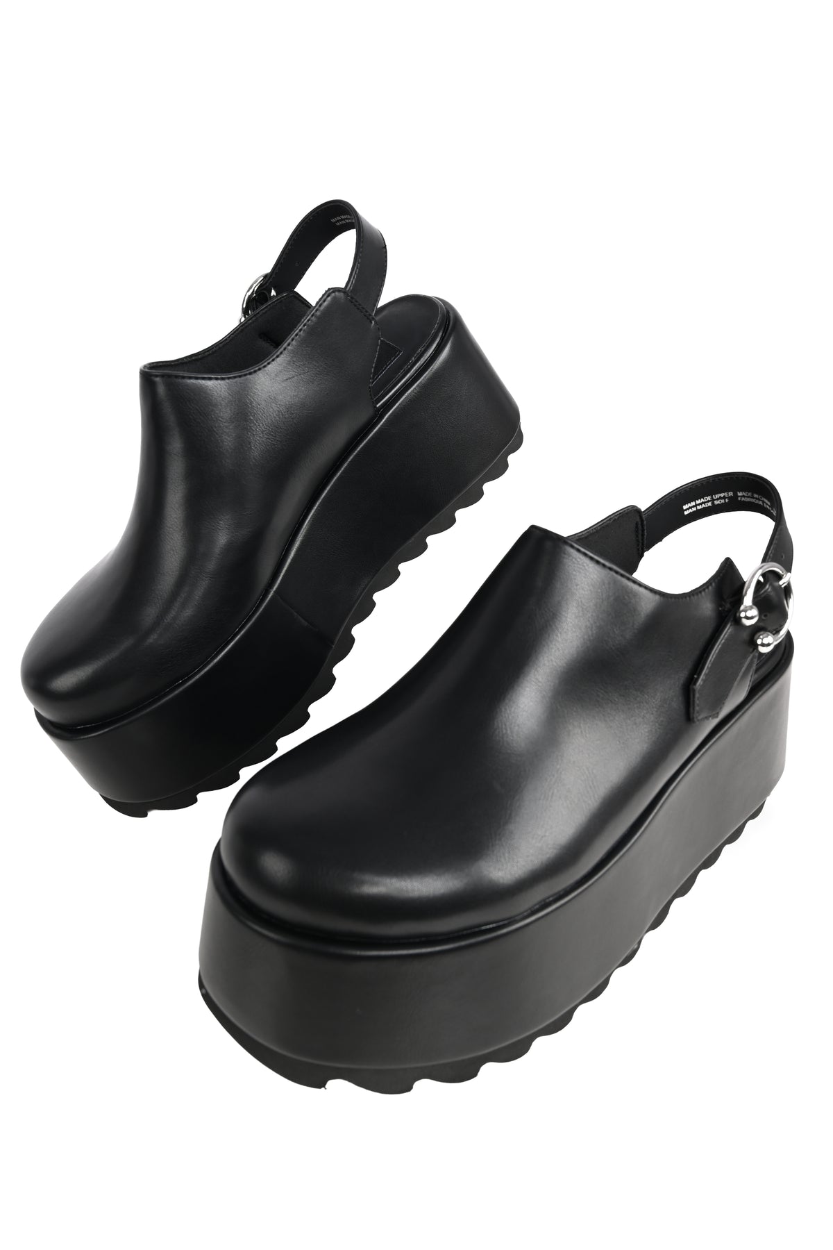 black platform clogs with a horseshoe piercing buckle
