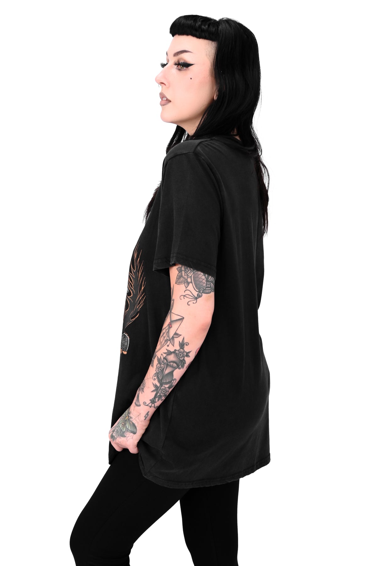 vintage black tee feature a haunted house with ghosts and two trick or treaters