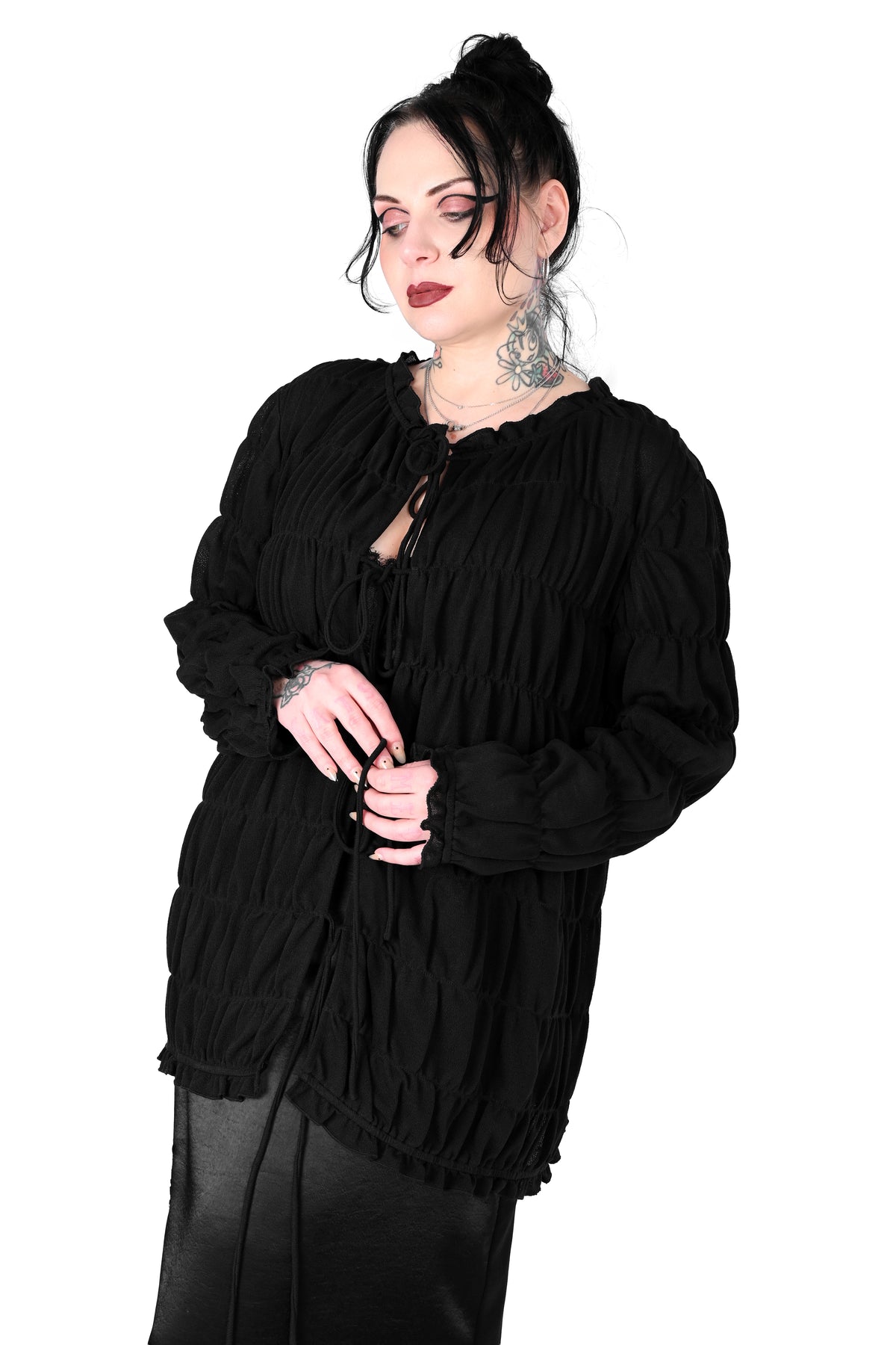 Tiered, open front long sleeve top with 3 adjustable ties.