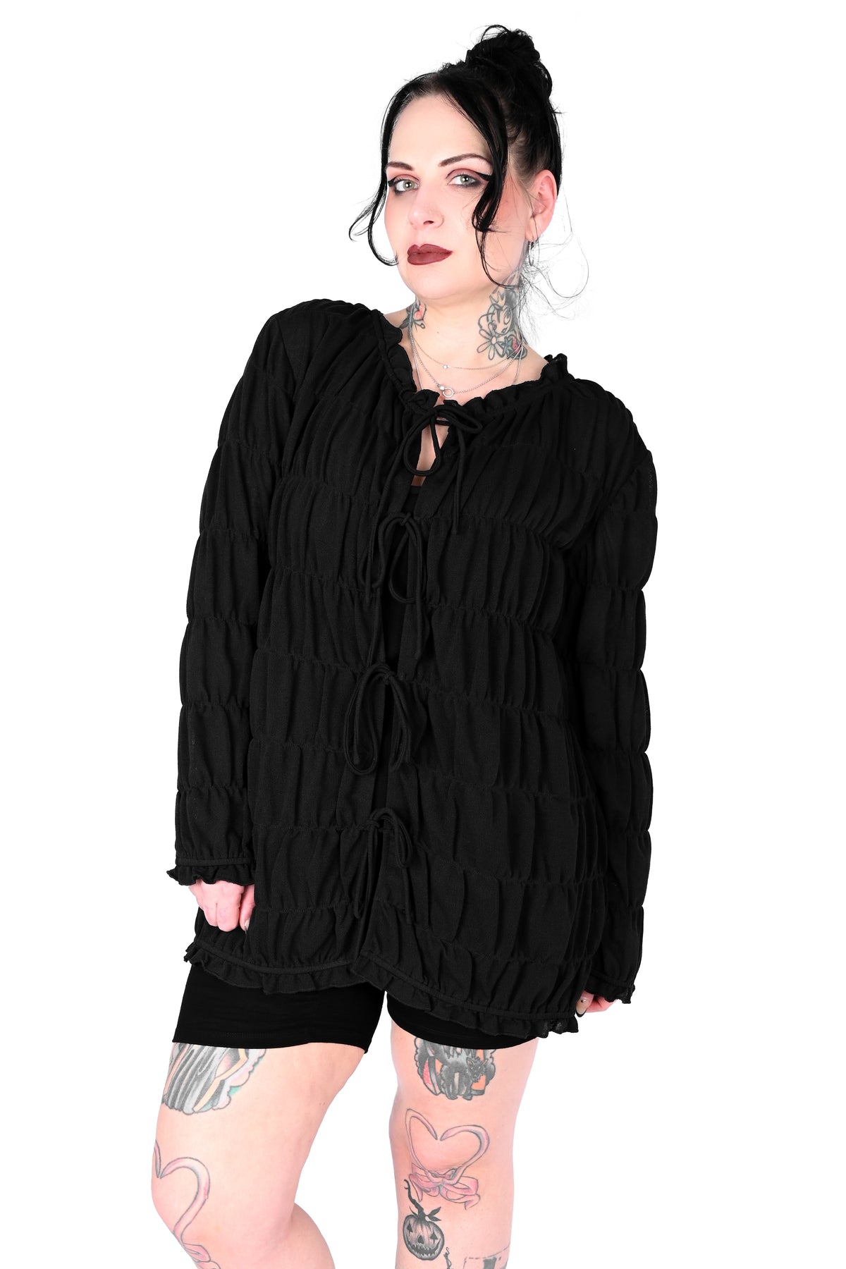 Tiered, open front long sleeve top with 3 adjustable ties.