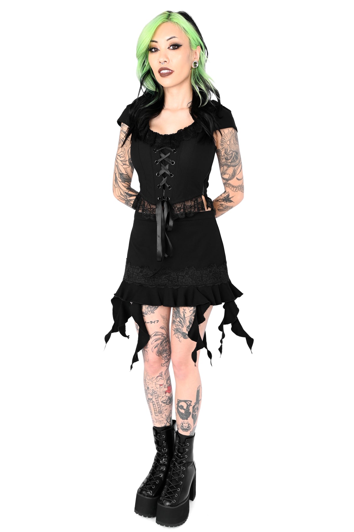 Black mini skirt with mixed length tendrils on the bottom.