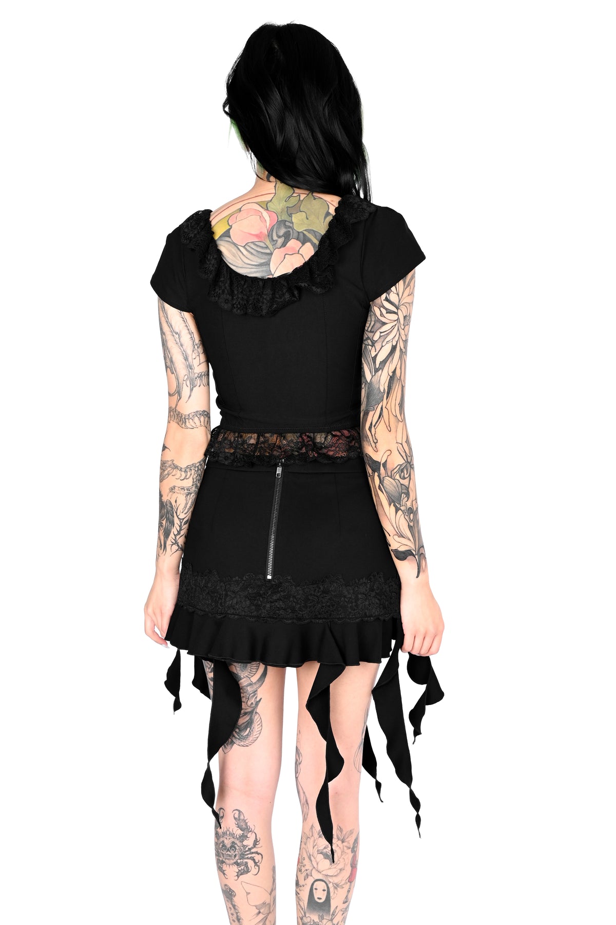 Black mini skirt with mixed length tendrils on the bottom.