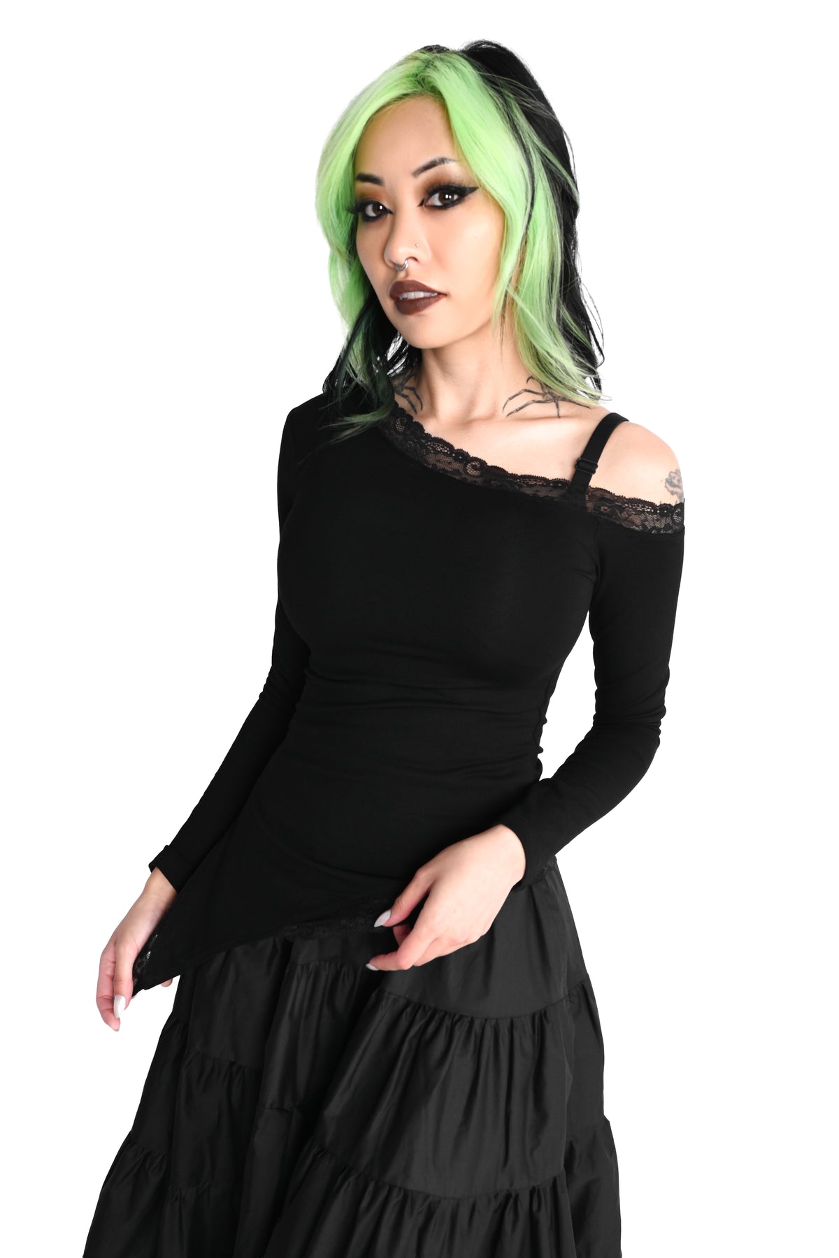 Black long sleeve top with one off the shoulder sleeve and a stretch lace trim.
