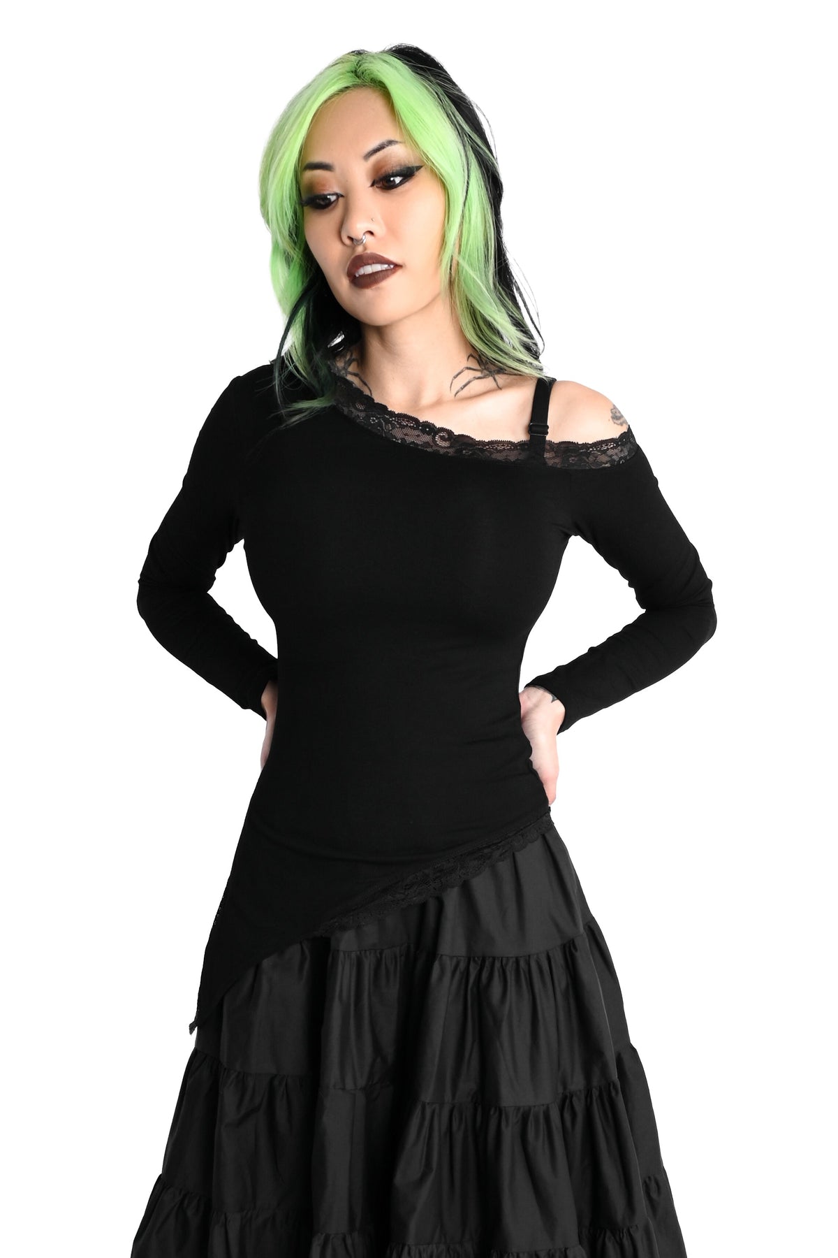 Black long sleeve top with one off the shoulder sleeve and a stretch lace trim.