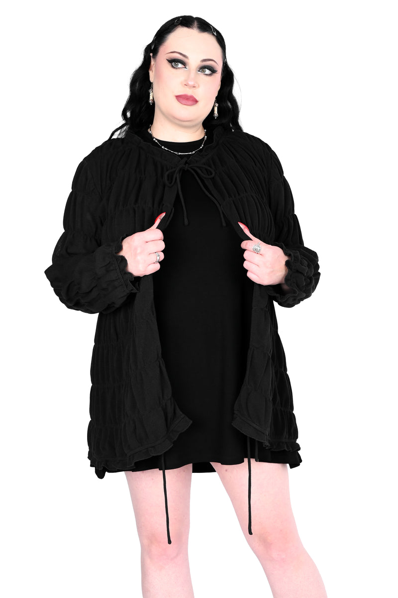 Tiered, open front long sleeve top with 3 adjustable ties.