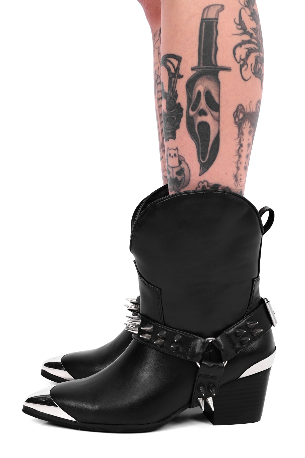 black cowboy boots with silver plated toes and spikes