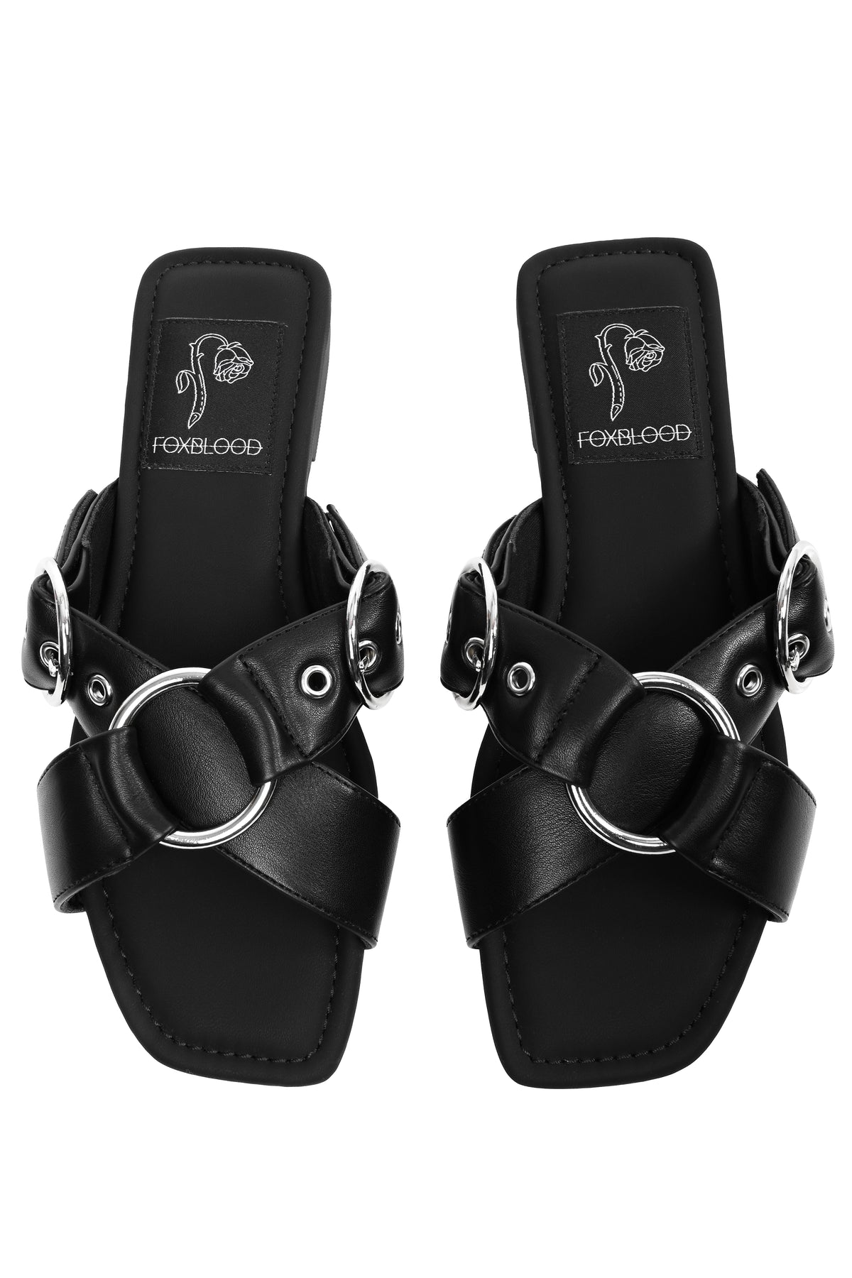 Black slide sandals with o-rings on top and adjustable buckles.