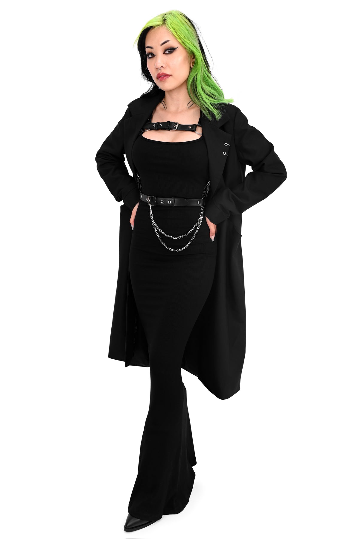 Long black trench coat with two o-ring piercing details on the left lapel