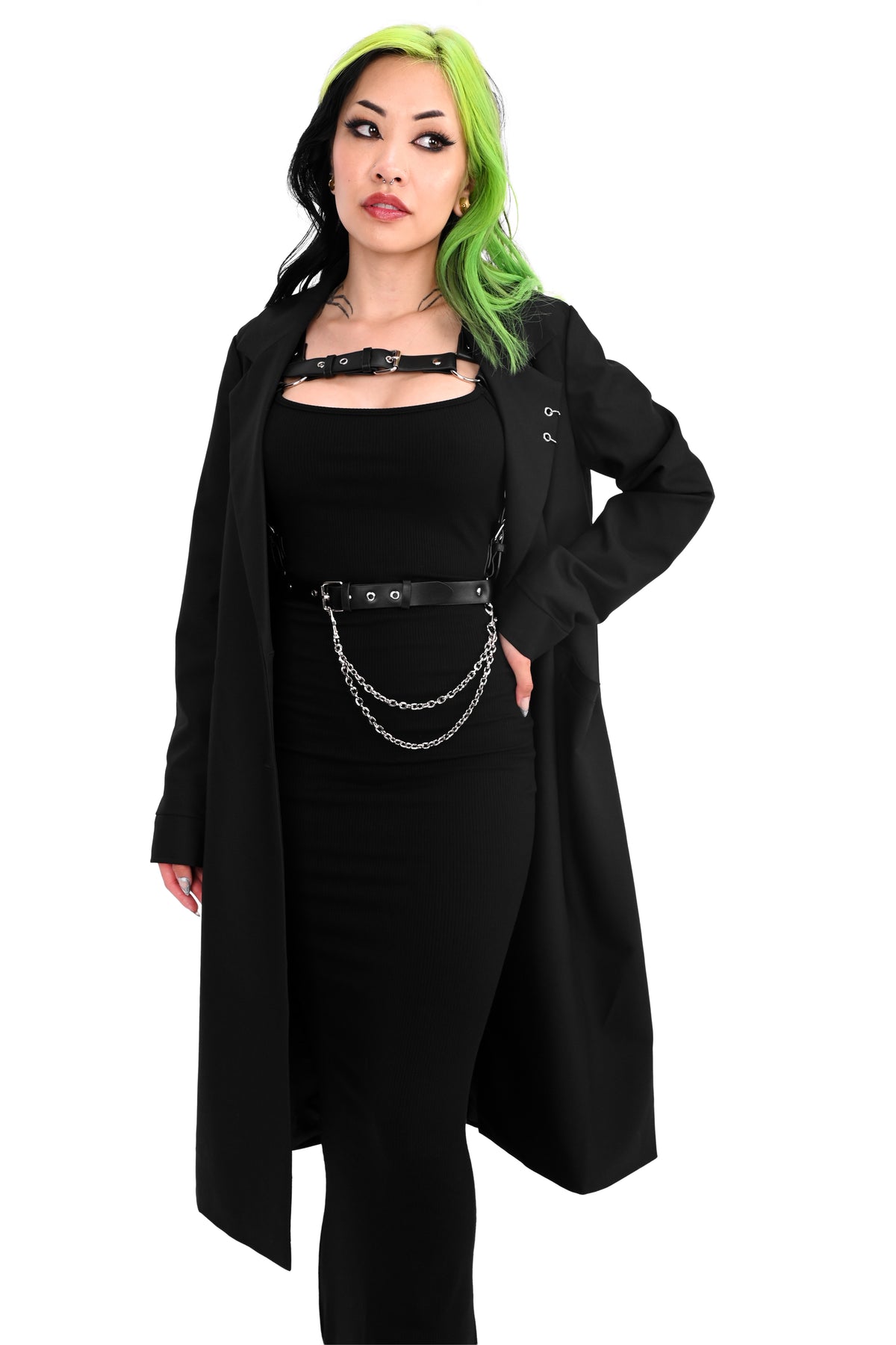 Long black trench coat with two o-ring piercing details on the left lapel