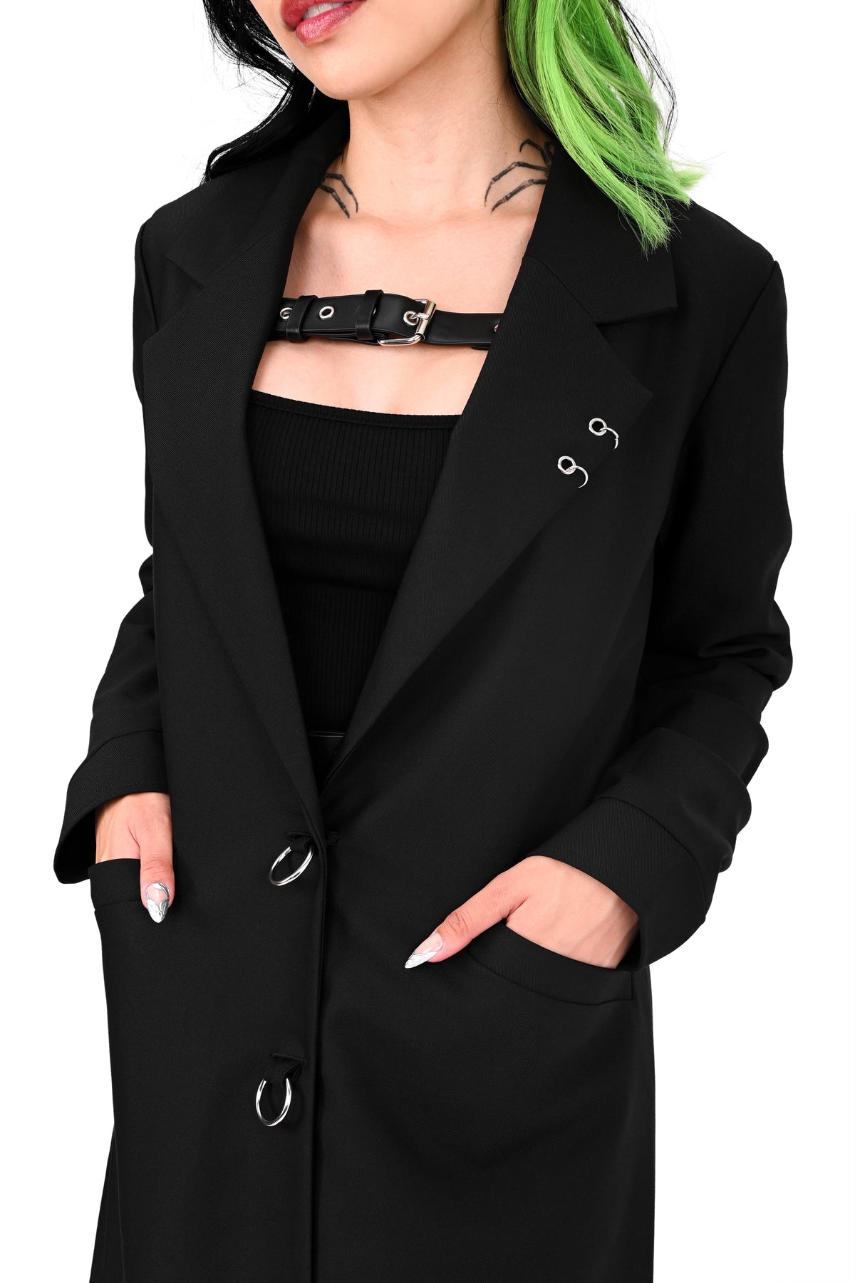 Long black trench coat with two o-ring piercing details on the left lapel
