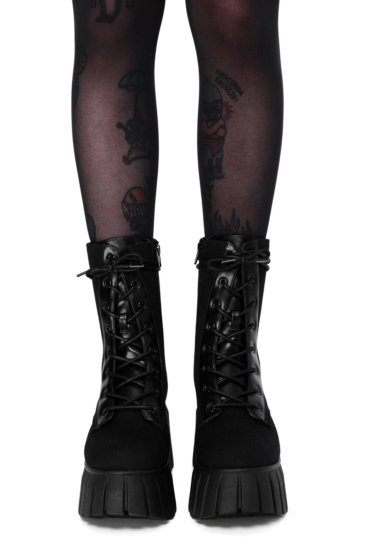 Black platform boots made out of a comfortable canvas and lace up front