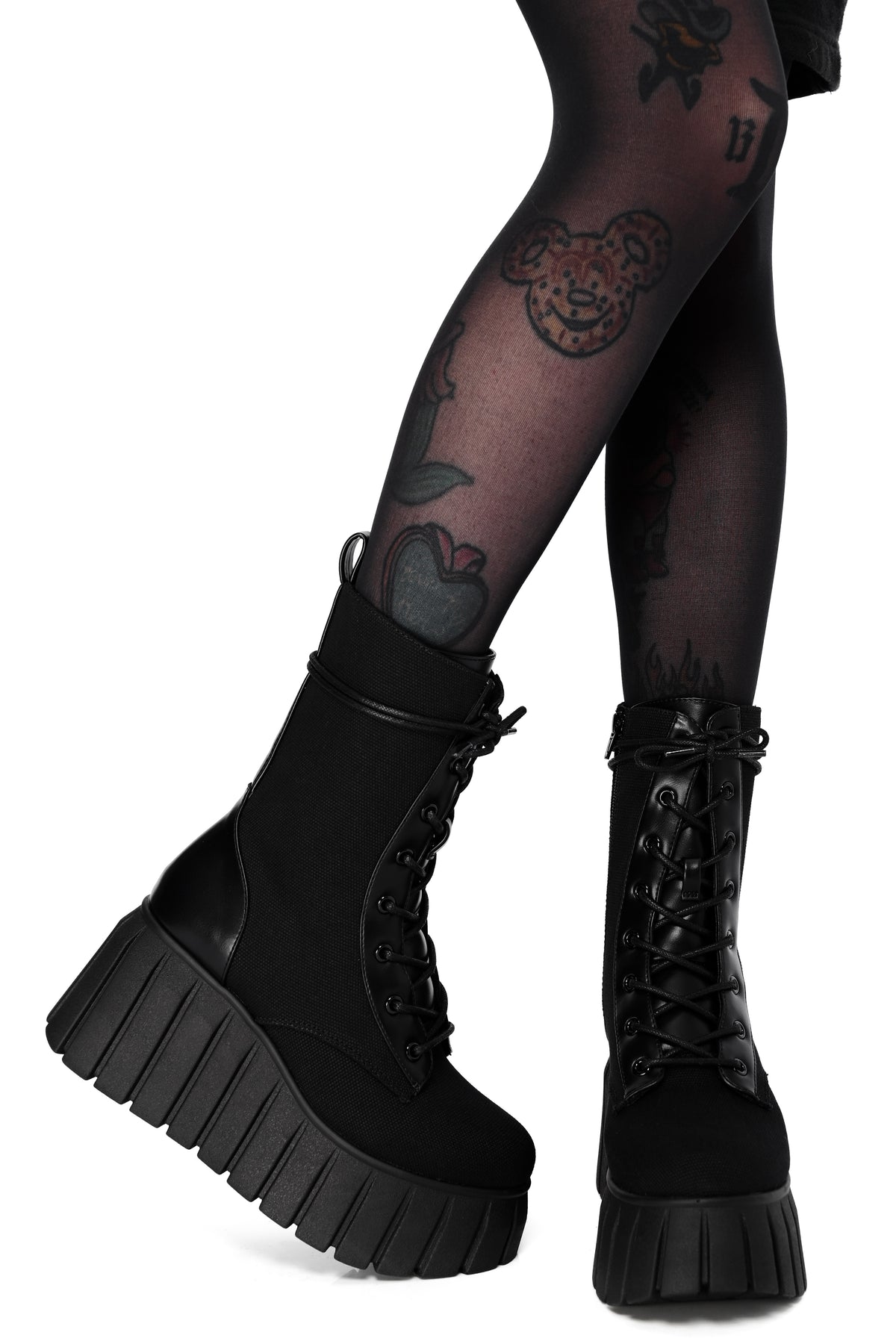 Black platform boots made out of a comfortable canvas and lace up front