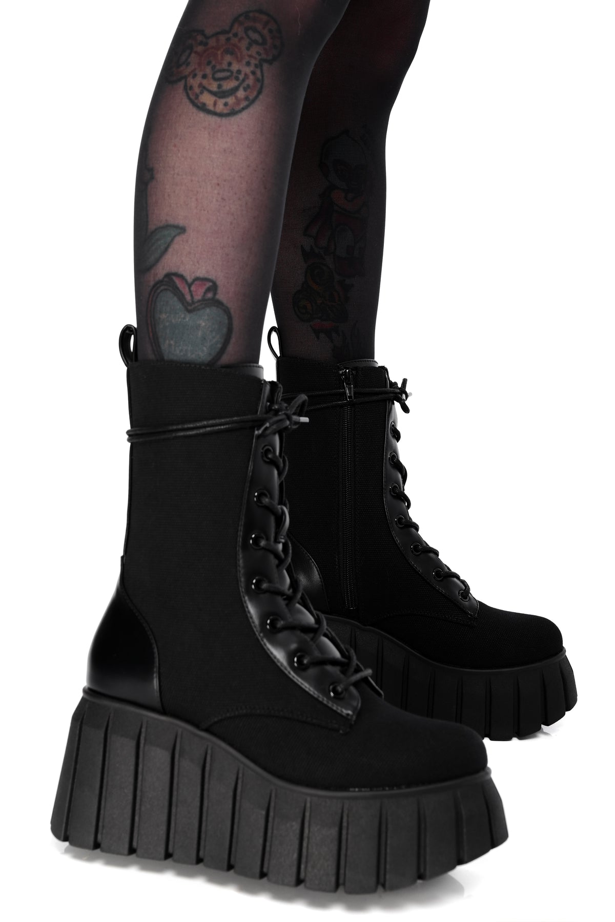 Black platform boots made out of a comfortable canvas and lace up front