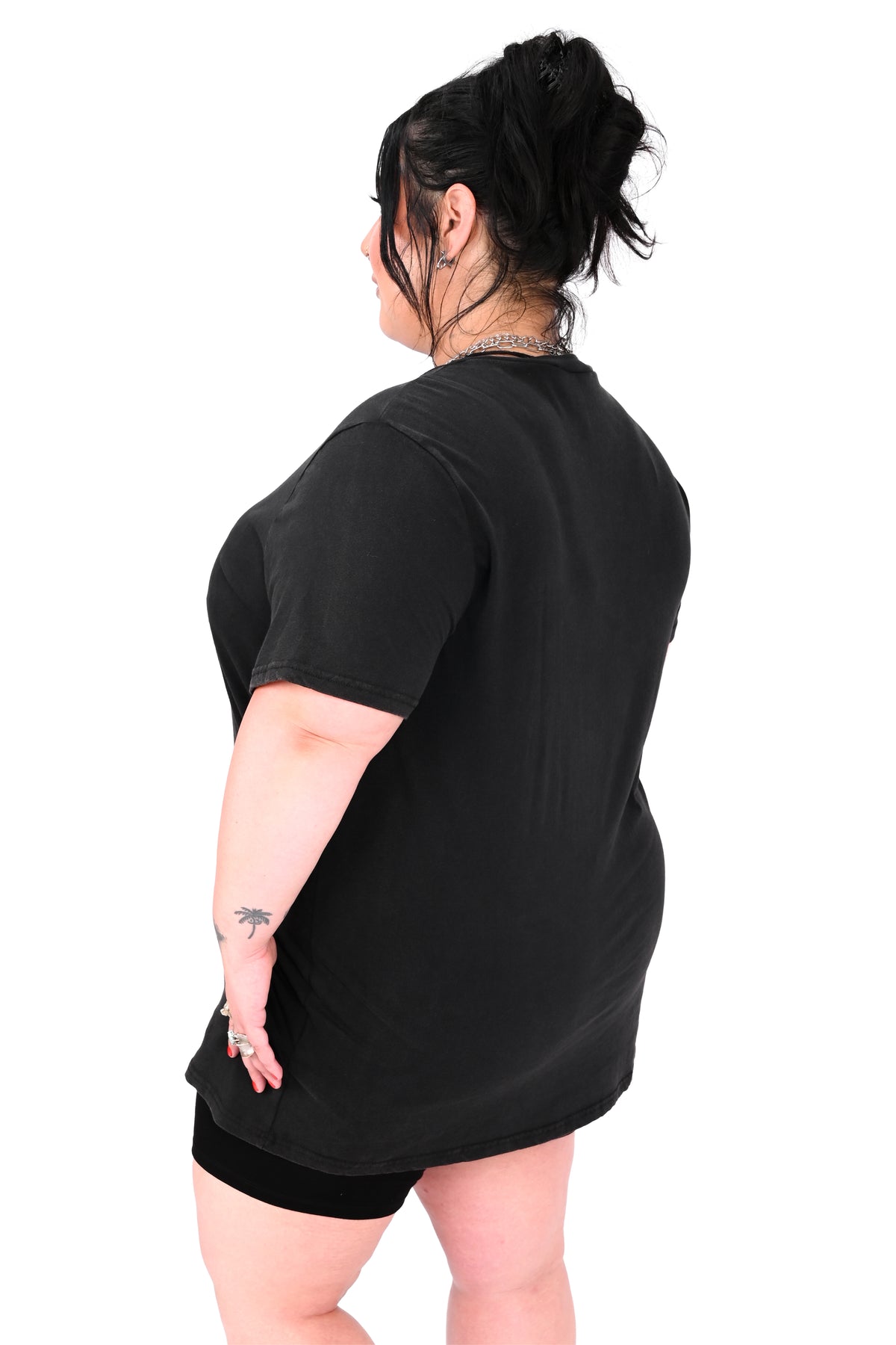 vintage black tee feature a haunted house with ghosts and two trick or treaters