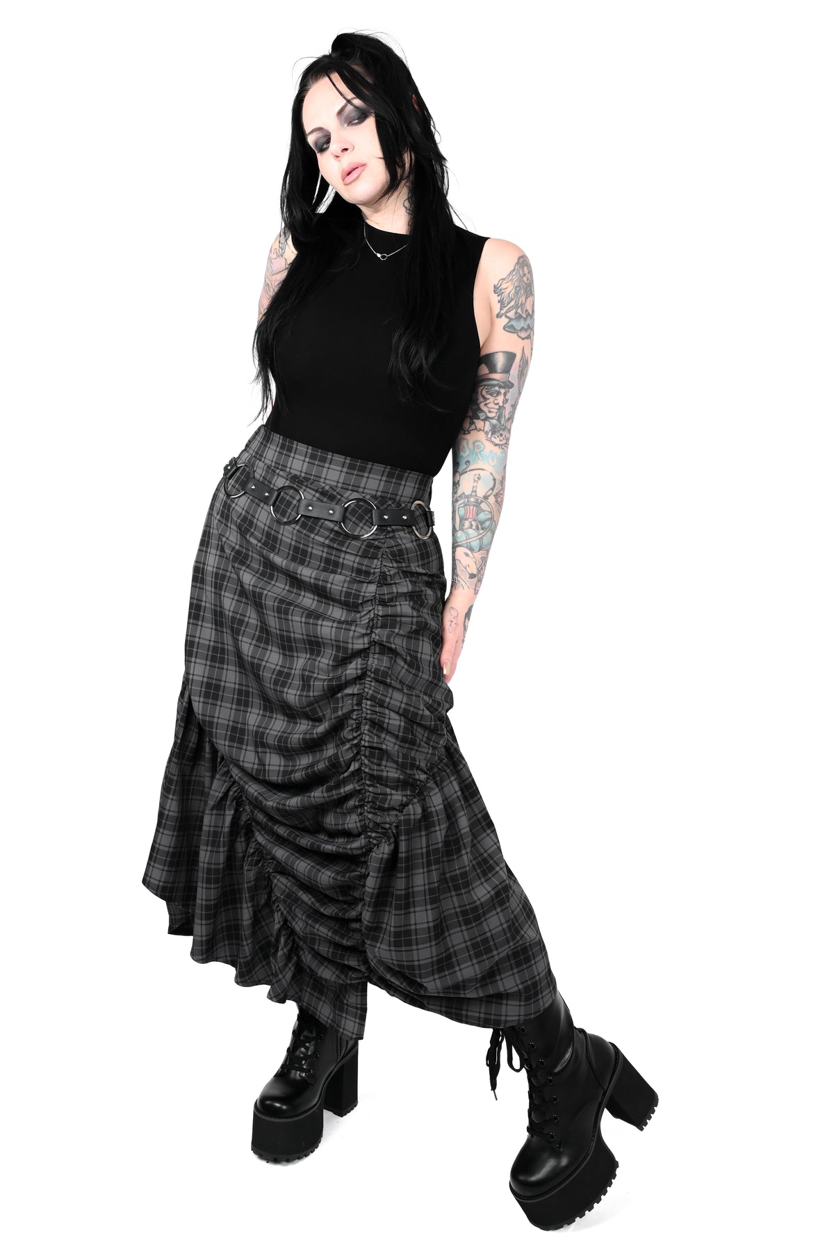 Front view medium sized model wearing a black sleeveless top, grey and black plaid skirt, styled with a chain belt and black platform boots