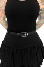 black faux leather belt with layered silver buckle