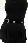 black flocked faux leather belt with silver western-style pendants and buckle