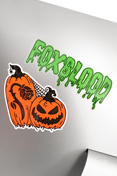 1 sticker with jackolanterns and carved foxblood rose, 1 with foxblood text logo in green slime