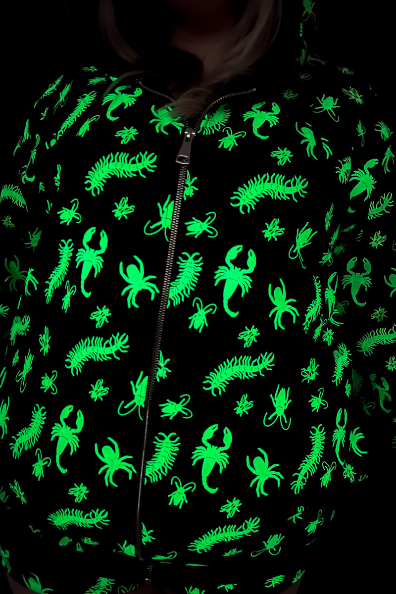 black zip up hoodie with green glow in the dark bug pattern