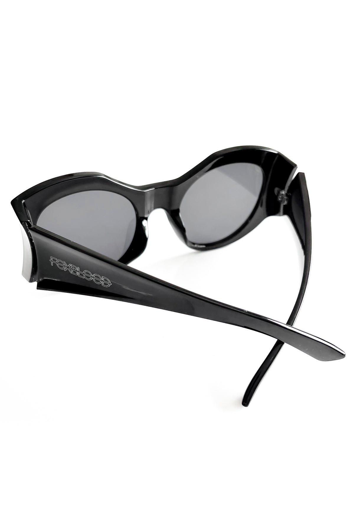 oversized black sunglasses with side indents and foxblood in white on the arm
