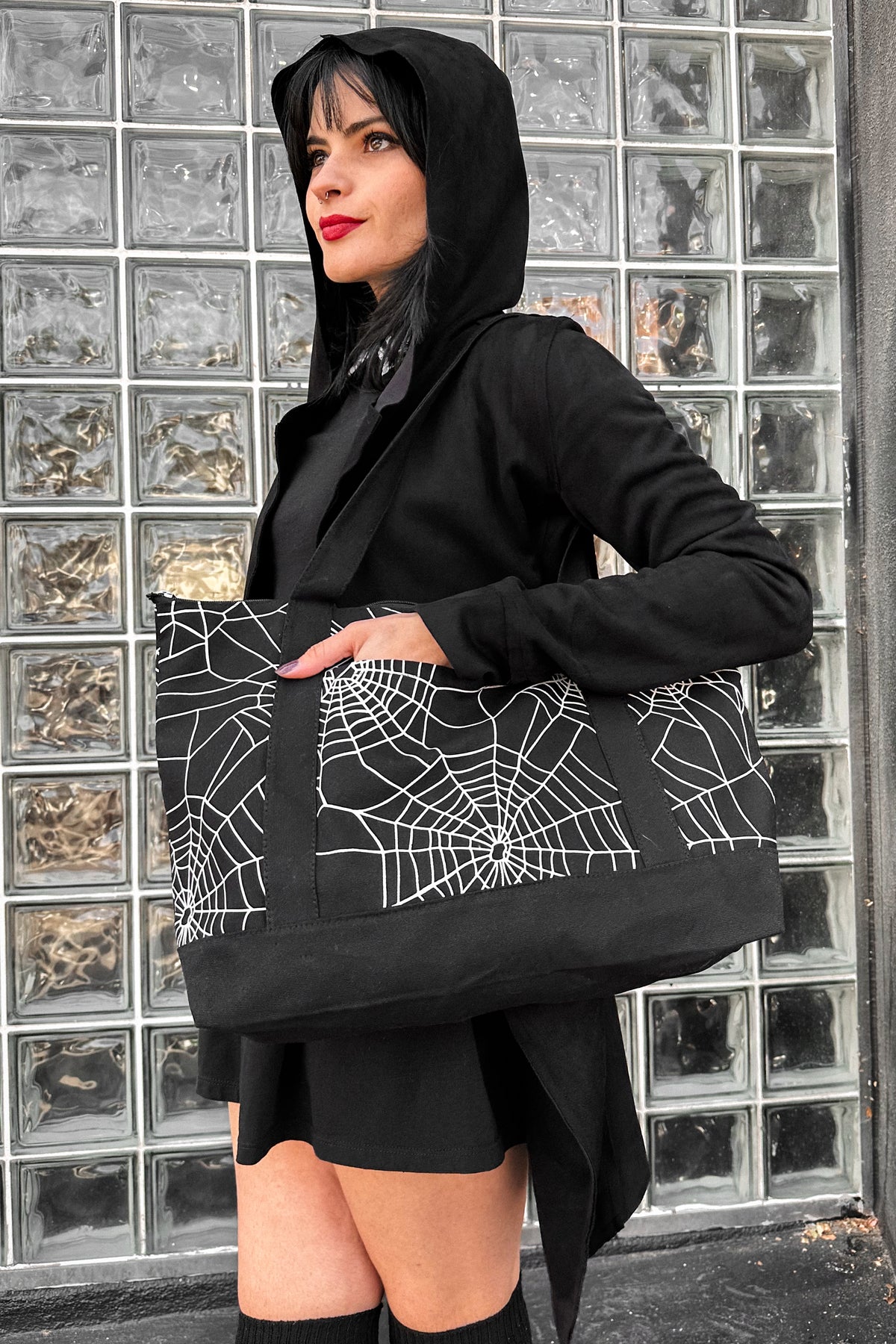 black zipper tote bag with all over cobwebs print