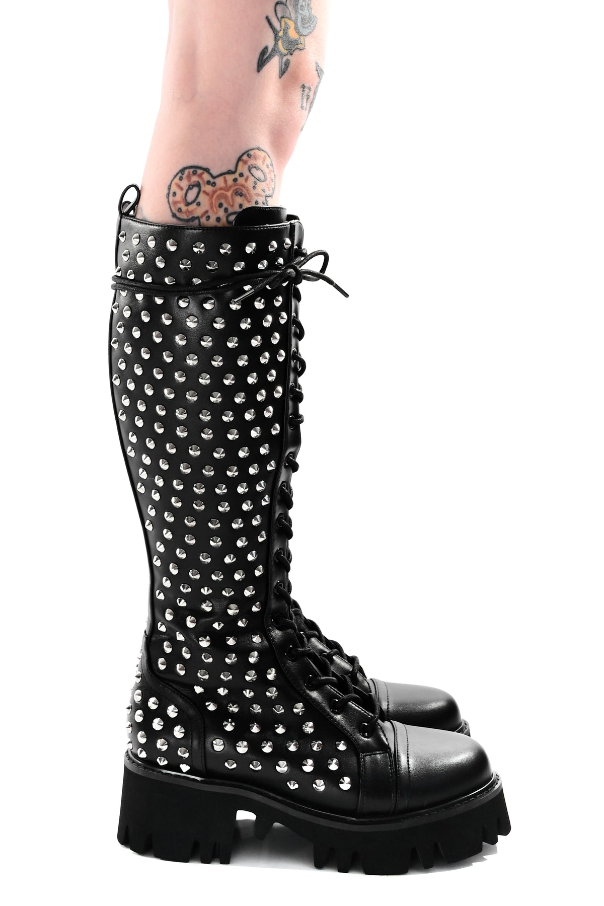 black vegan leather knee high boots covered in silver cone studs