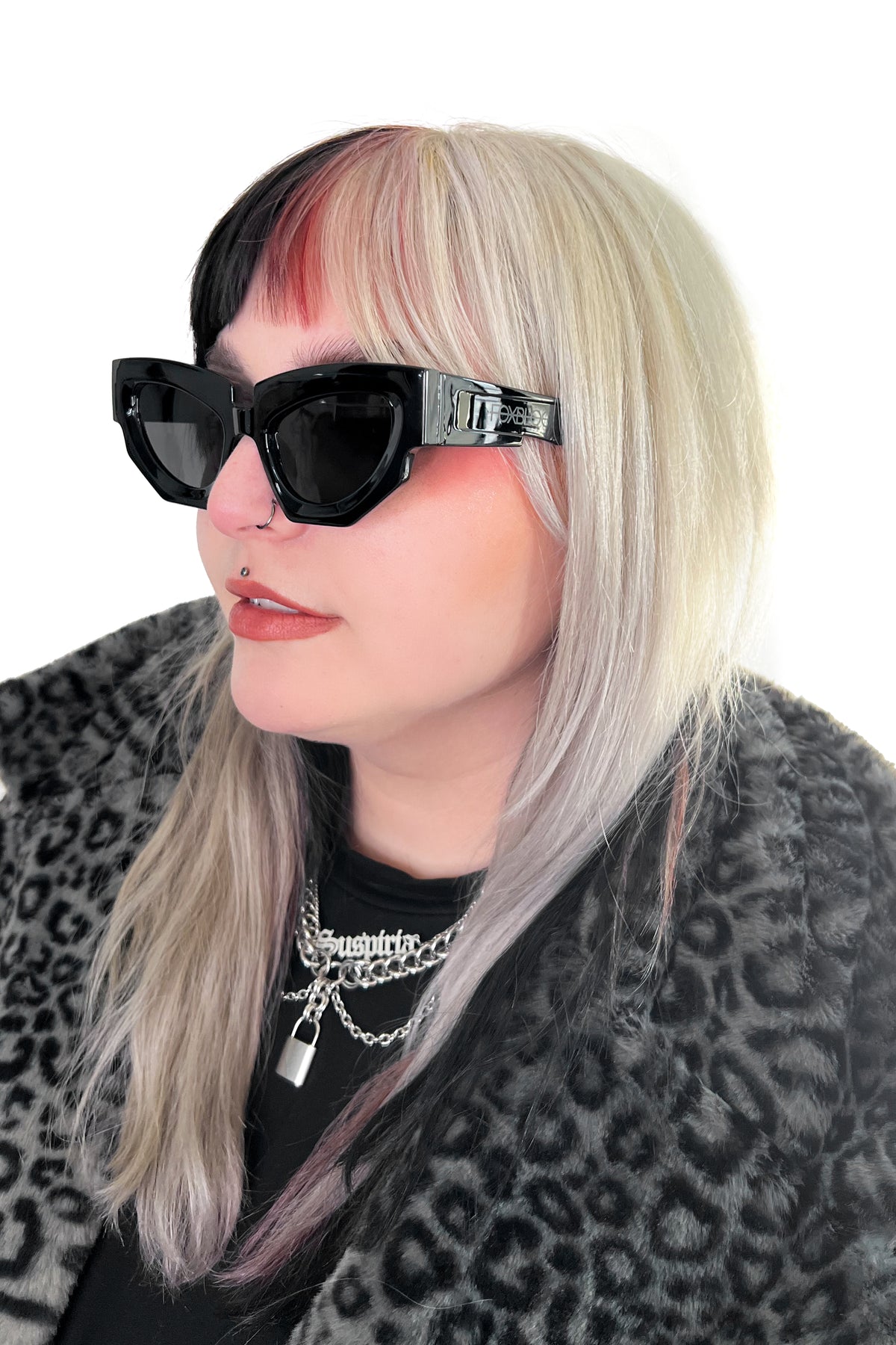 Slightly oversized black cat eye sunglasses with thick frames