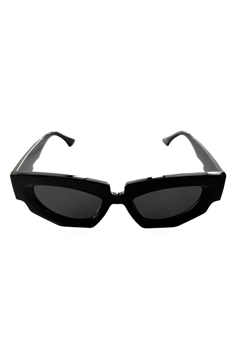 Slightly oversized black cat eye sunglasses with thick frames