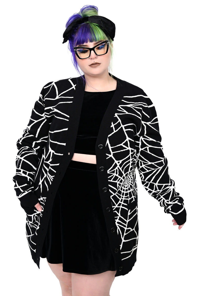 black unisex cardigan with all over white spider web design