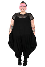 black oversized drop crotch jumpsuit with thin shoulder straps